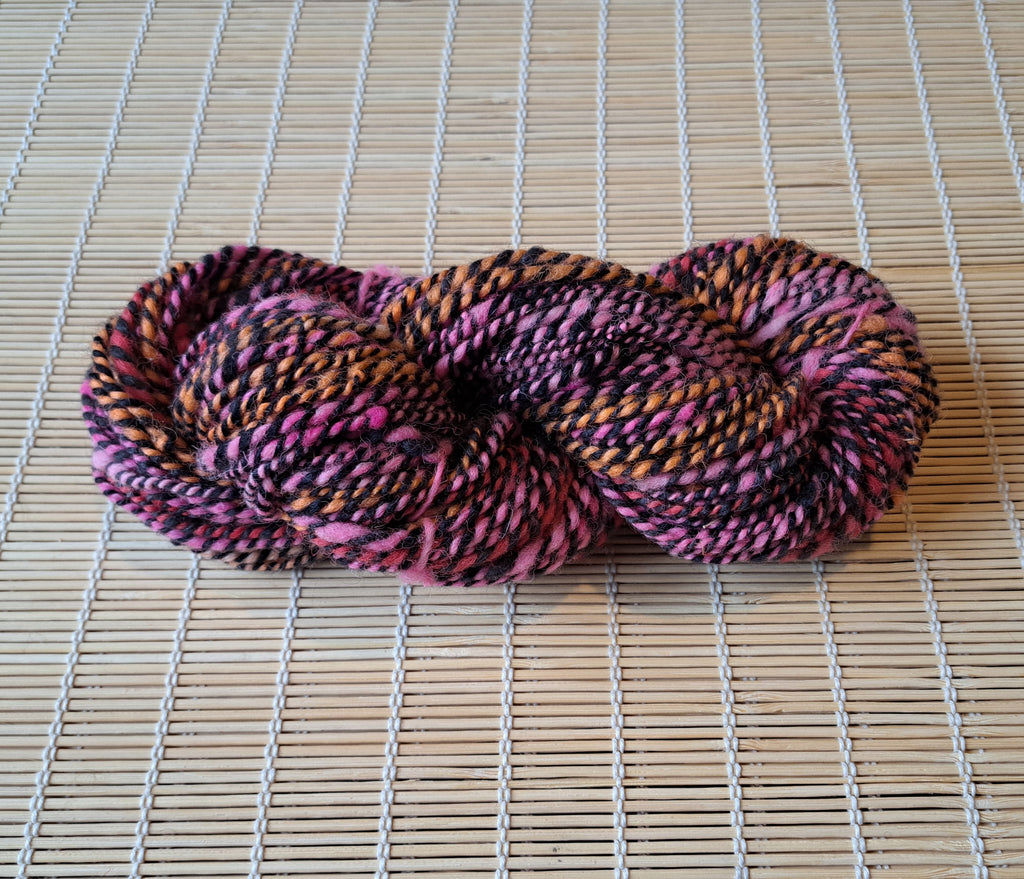 Strawberry Liquorice - tones of bright orange, pink and purple interlaced with black